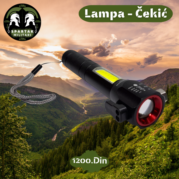 Multifunkcionalna lampa sa crvenim prstenom i kaišem, položena u planinskom okruženju.