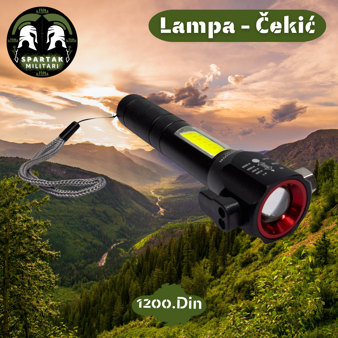 Multifunkcionalna lampa sa crvenim prstenom i kaišem, položena u planinskom okruženju.